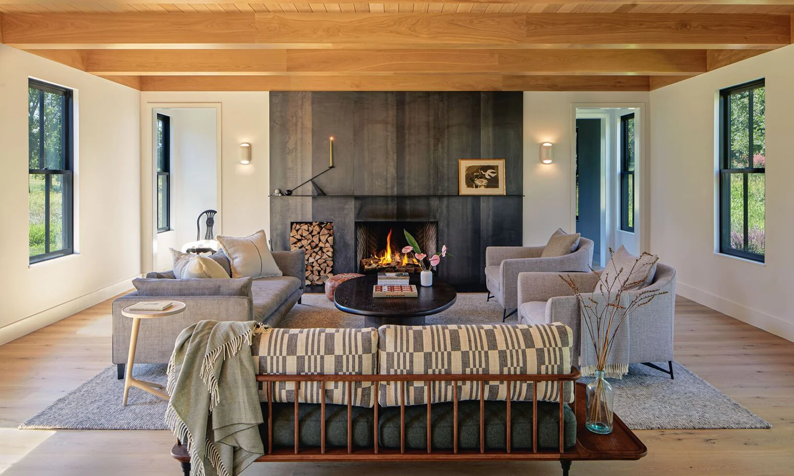 Living room with a lit fireplace